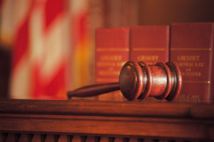 Credit disability insurance claim denied attorney gavel on stand